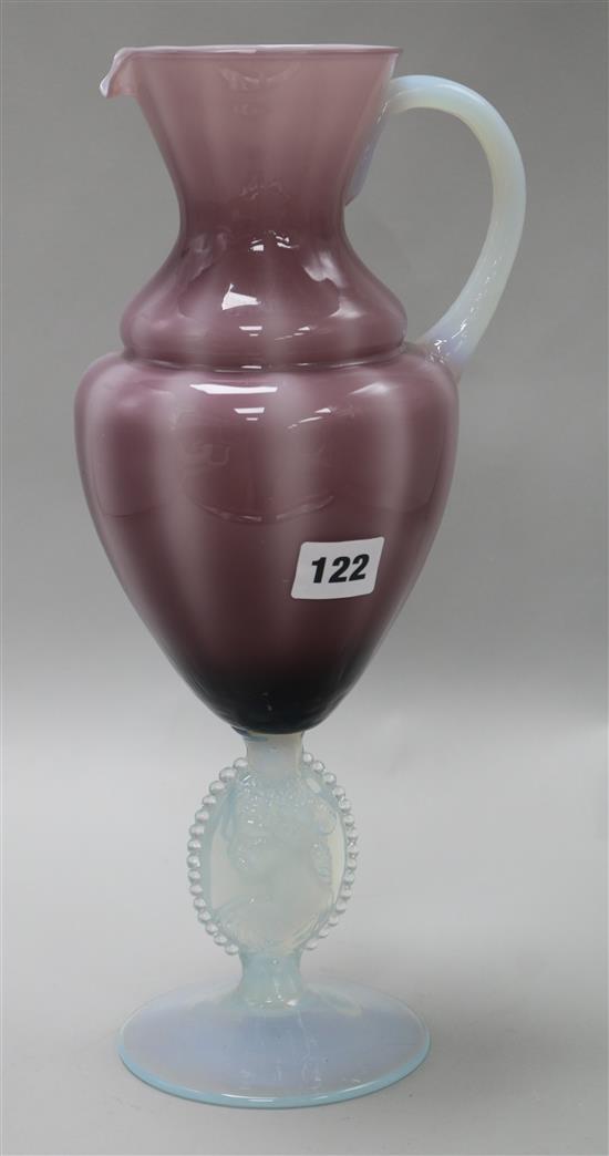 A glass opalescent and mauve coloured ewer